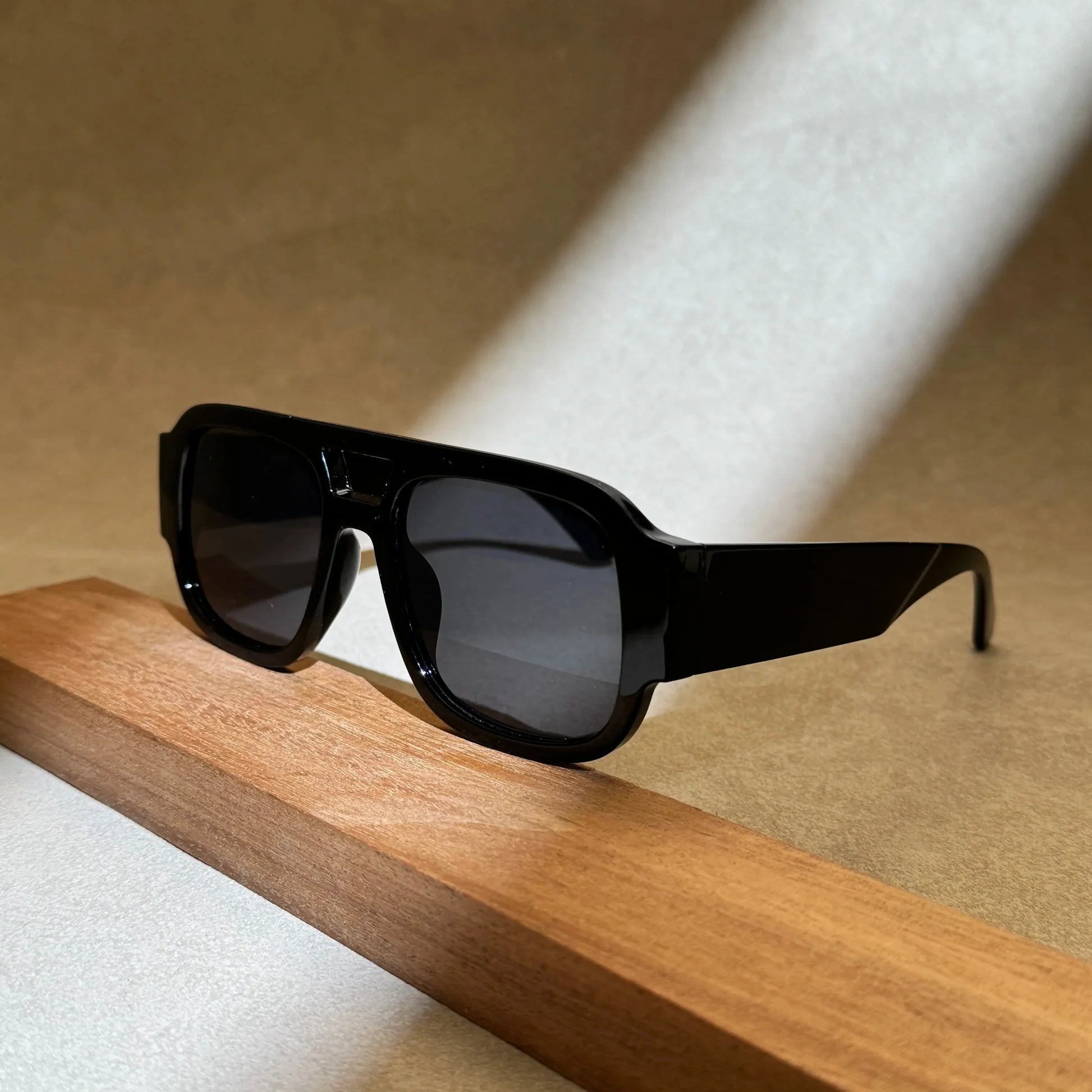 Black aviator sunglasses detail